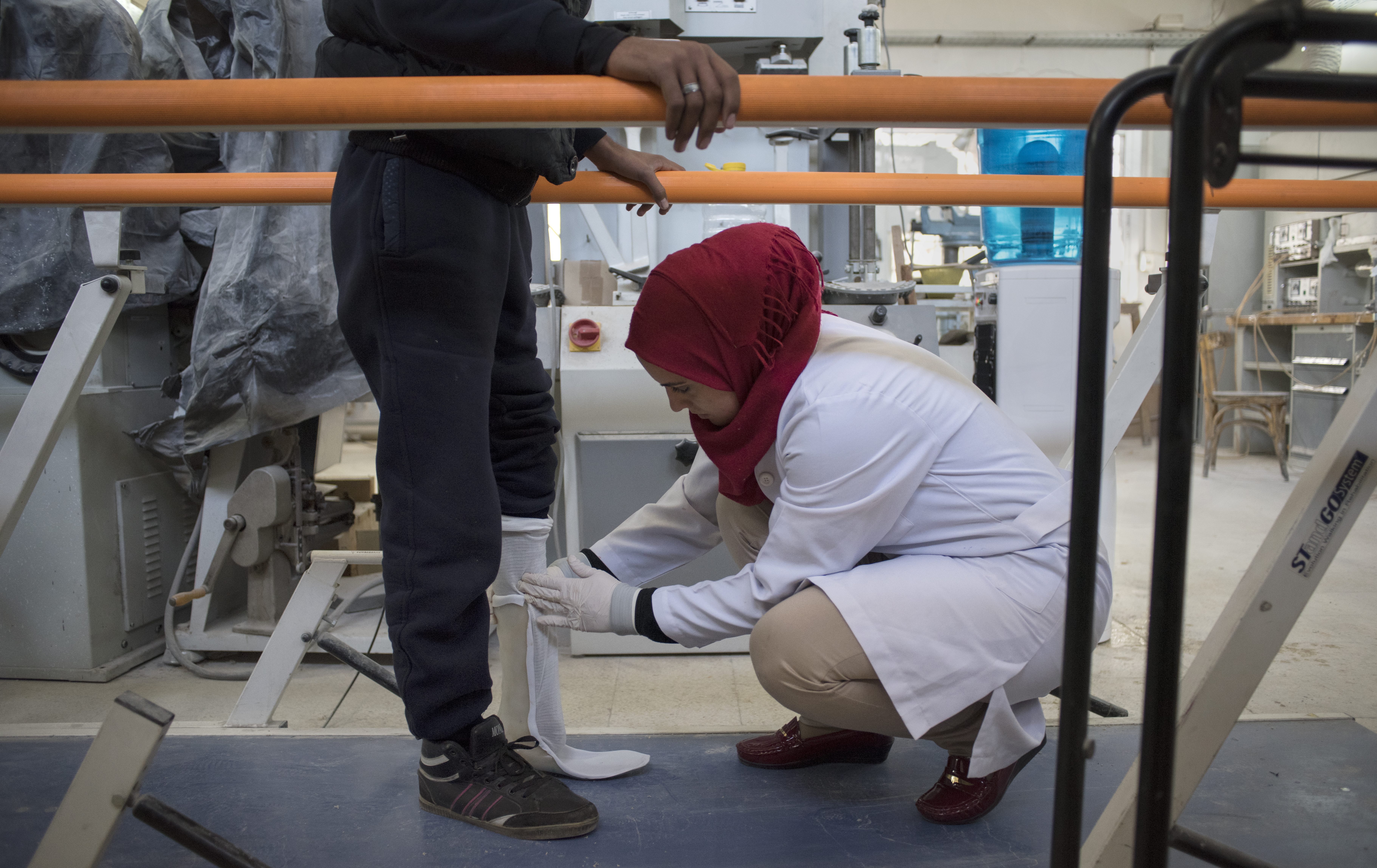 Damascus Syria rehabilitation centre A technician fits Ismail, 17, from Qamishli, for a prosthetic foot