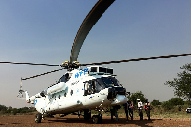 A UN helicopter delivering ‘EWARS in a box’ surveillance kits, Mingkaman, South Sudan. 
