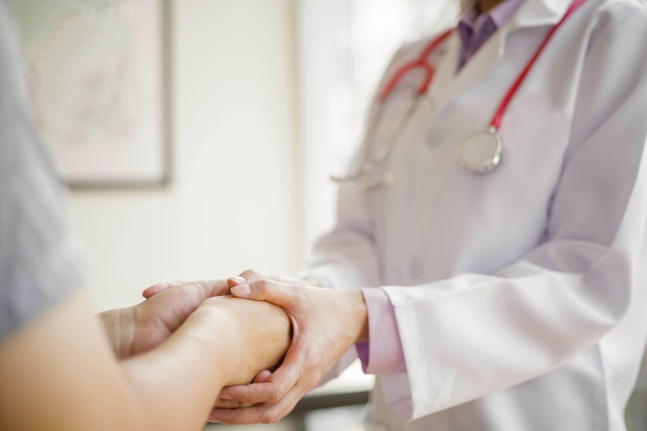 holding hands patient doctor
