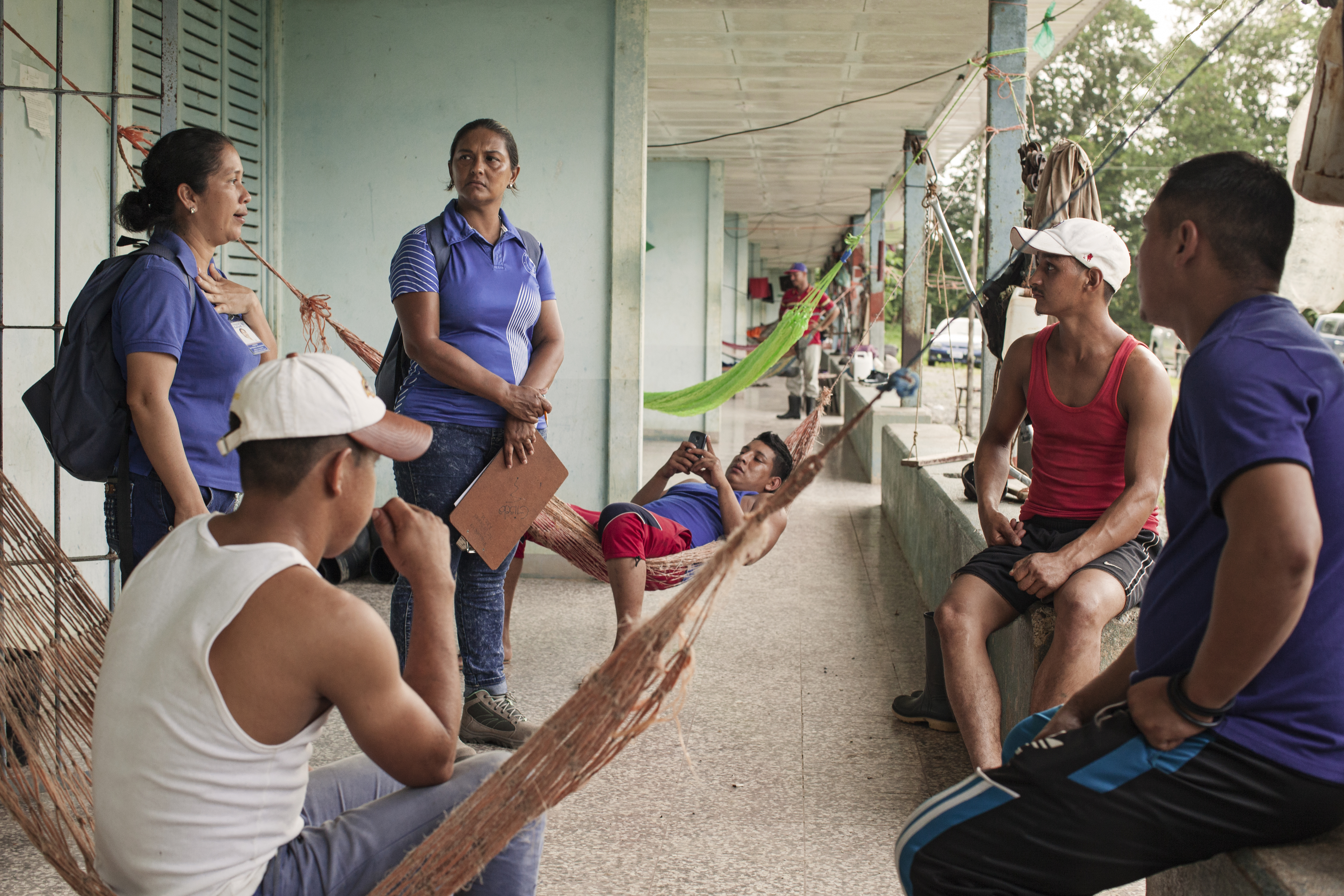 talking with workers inspecting malaria costa rica