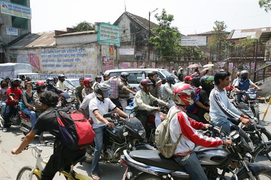 urban health traffic nepal motorcyclists in traffic in Nepal