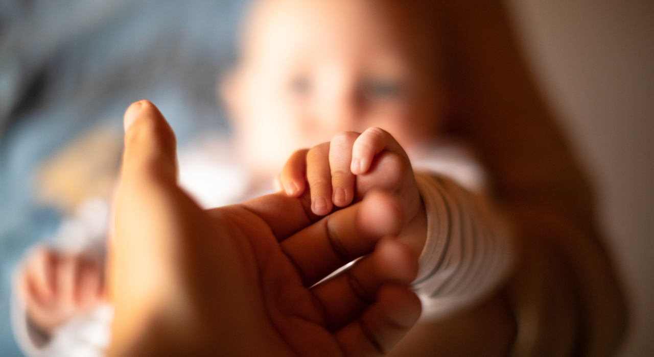 Child holding hand