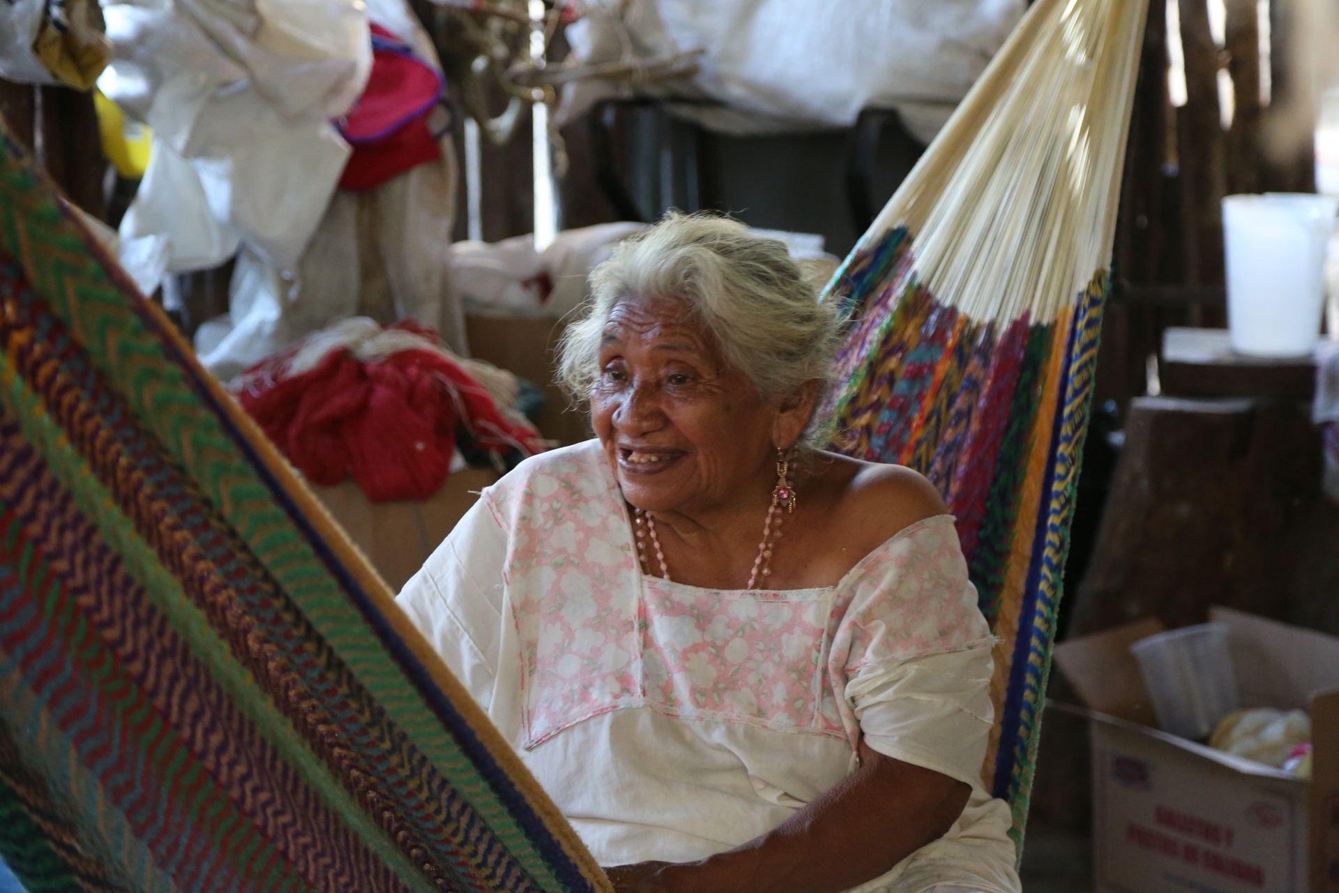 A photo of an elderly woman resting.