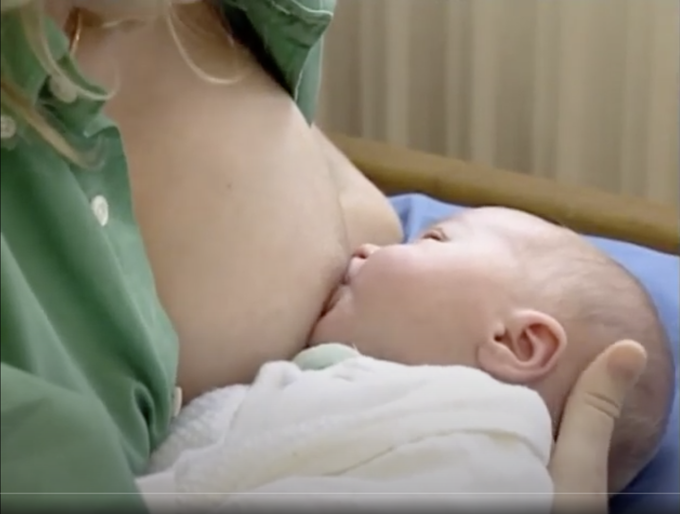 IMCI training video Breastfeeding position attachment Pediatricians examine a 9-month child