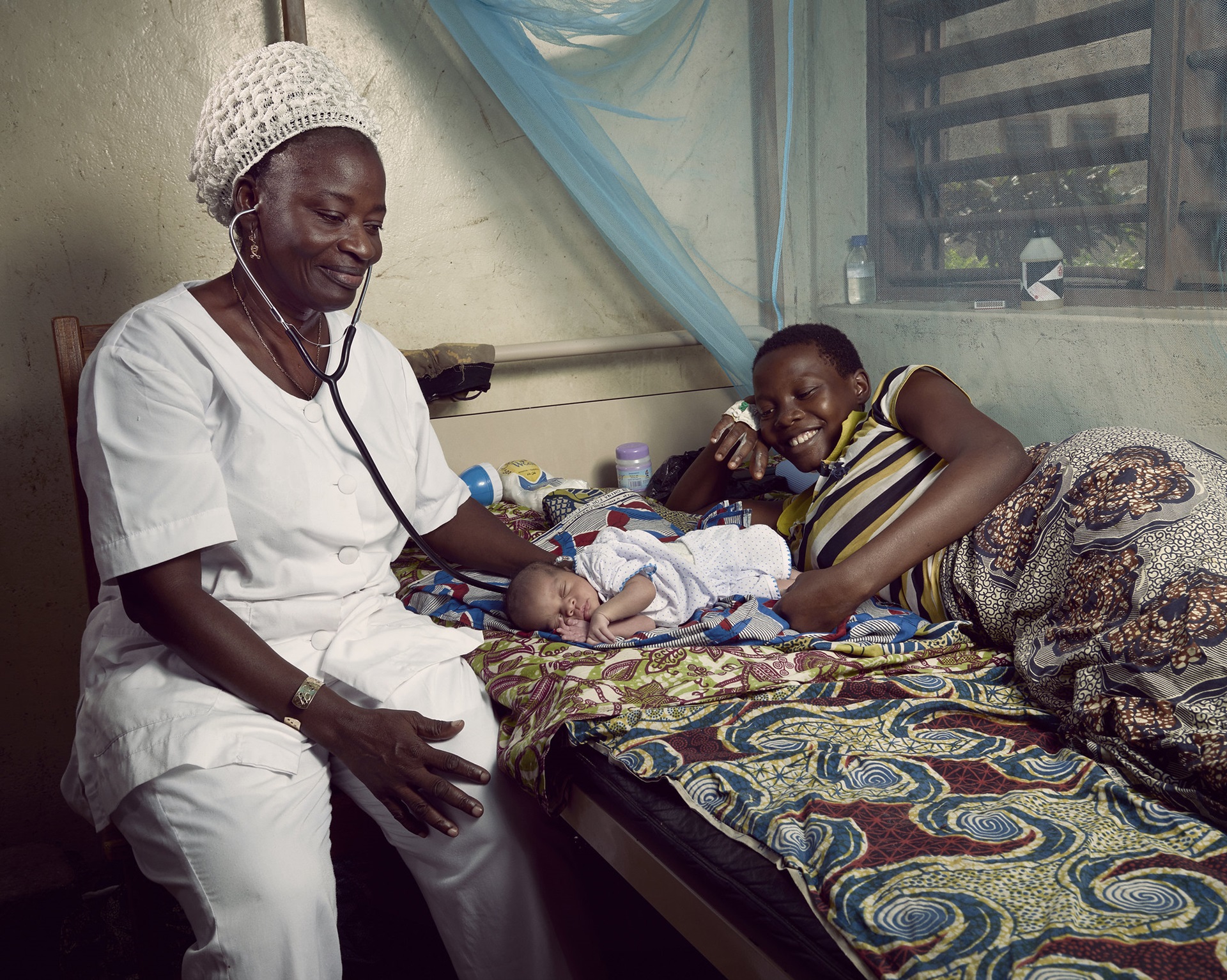 Quality of care Benin credit Stephan Gladieu World Bank nurse taking care of newborn Benin