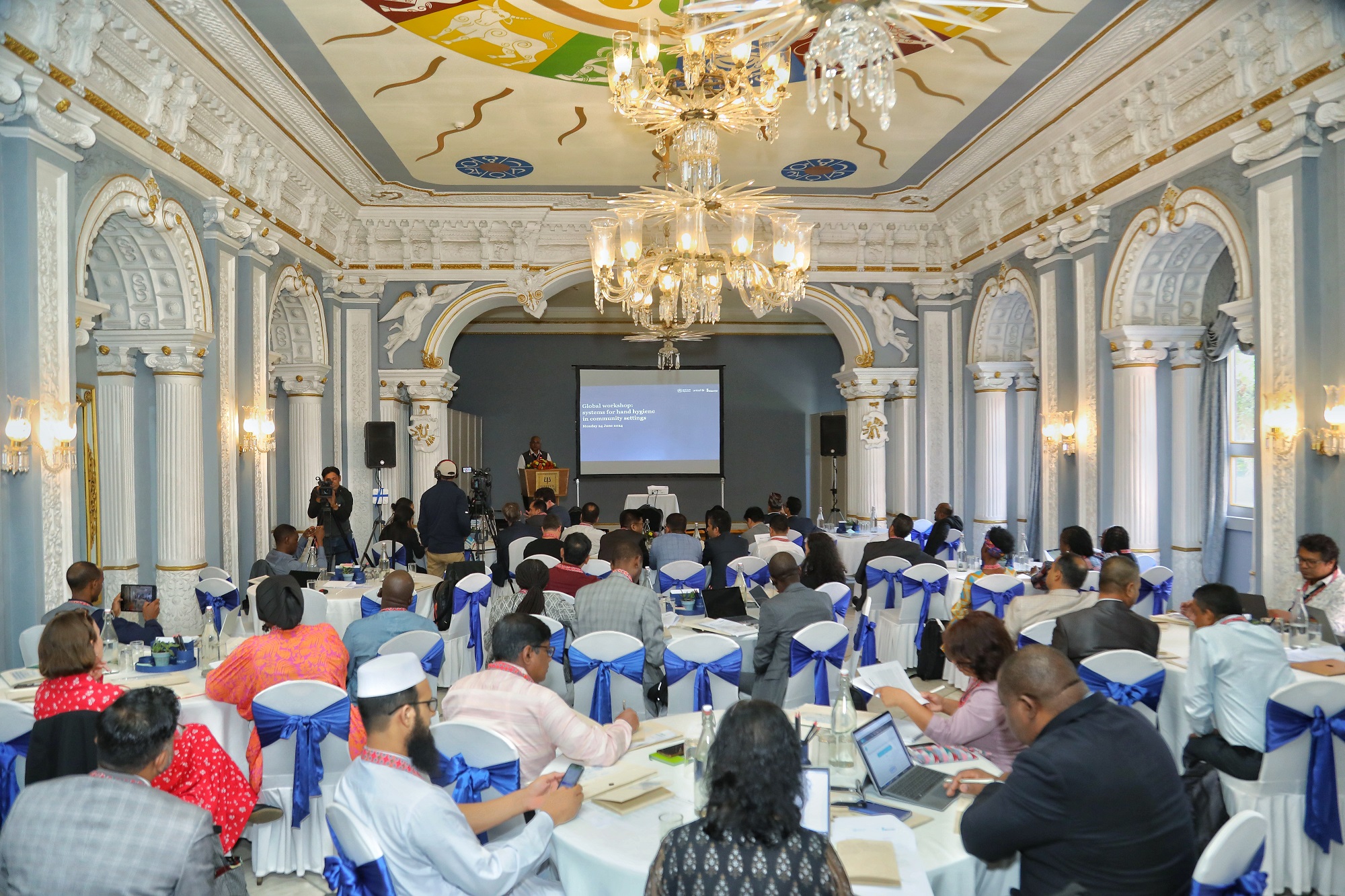 A photo showing the participants and stage of the global workshop on systems for hand hygiene in community settings held in Bagmati province, Nepal