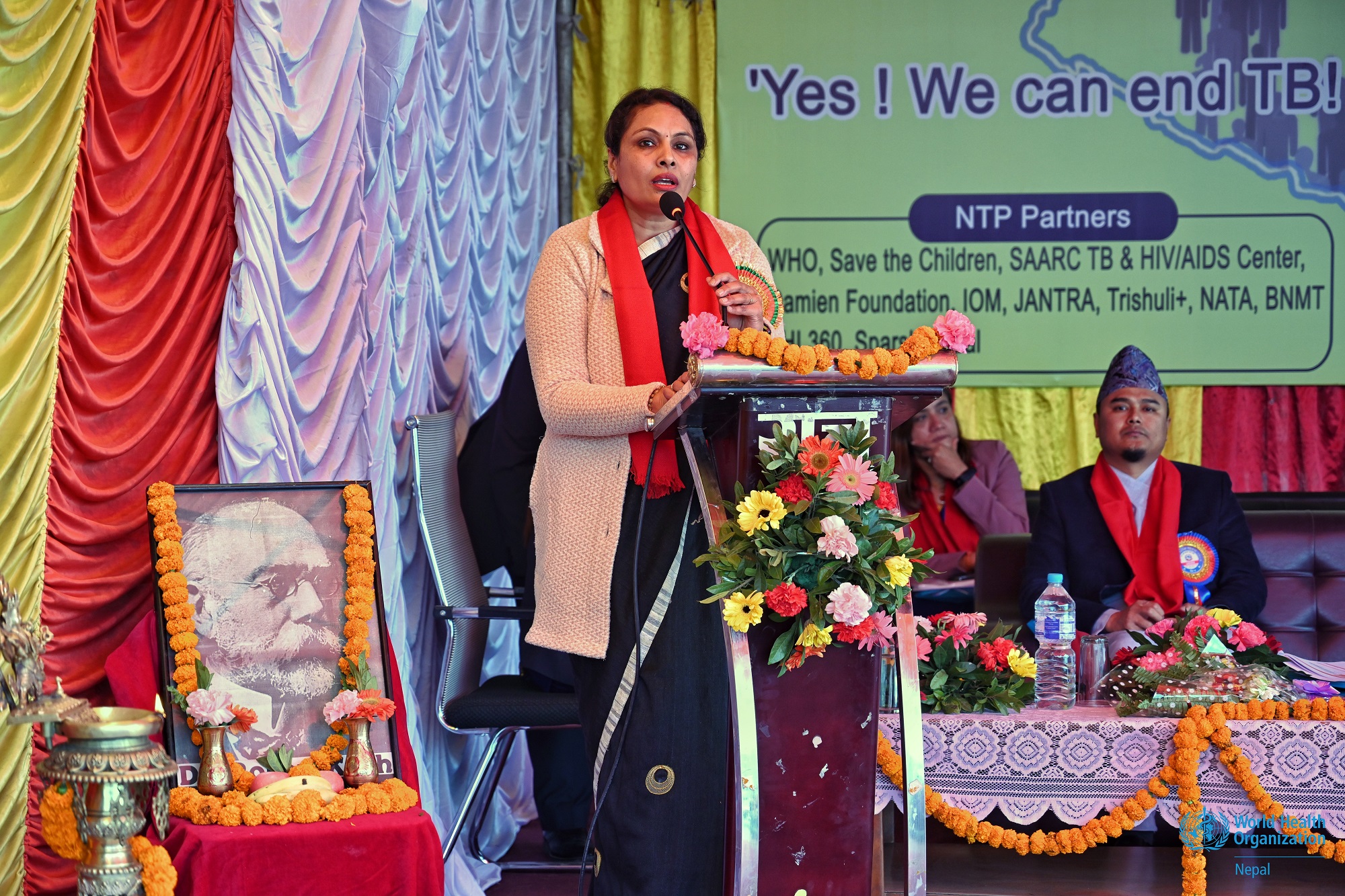 Dr Sangeeta Kaushal Mishra, Director General of the Department of Health Services, Ministry of Health and Population, providing her remarks on a podium at the commemoration of World Tuberculosis Day 2024 in Bagmati Province, Nepal