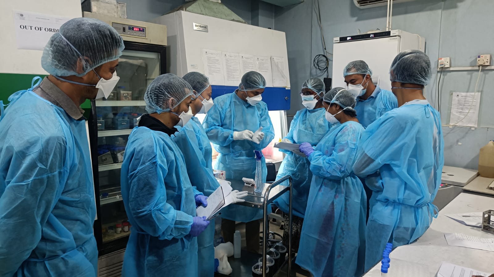 Lab professionals working in a lab in a 3-day laboratory training to strengthen national diagnostic capacity for drug-resistant tuberculosis treatment