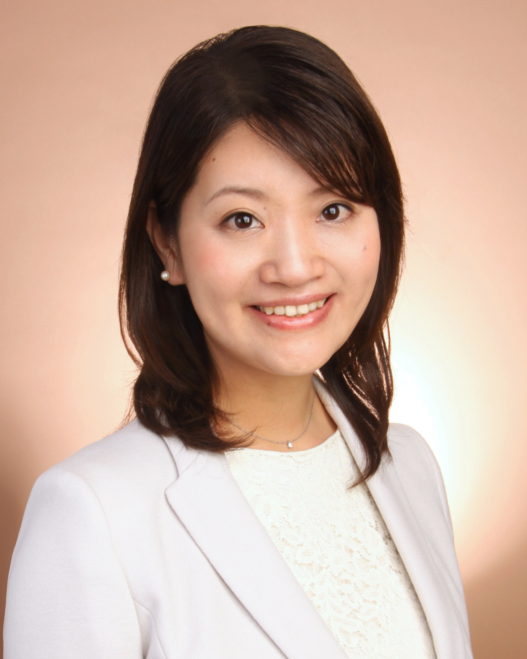 Portrait photo of a woman with shoulder long hair.