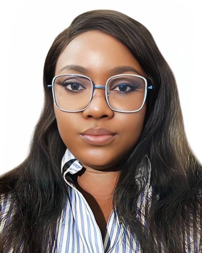 Portrait photo of a woman with long hair and wearing glasses.