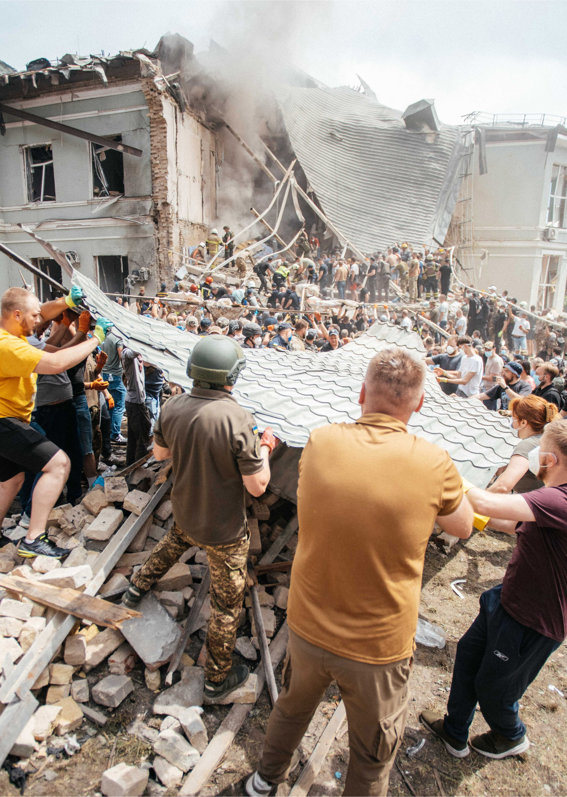Health workers and community members working to clear the rubble after hostilities.