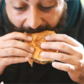 man eating burger