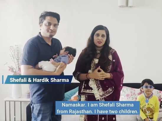 parents standing with their child