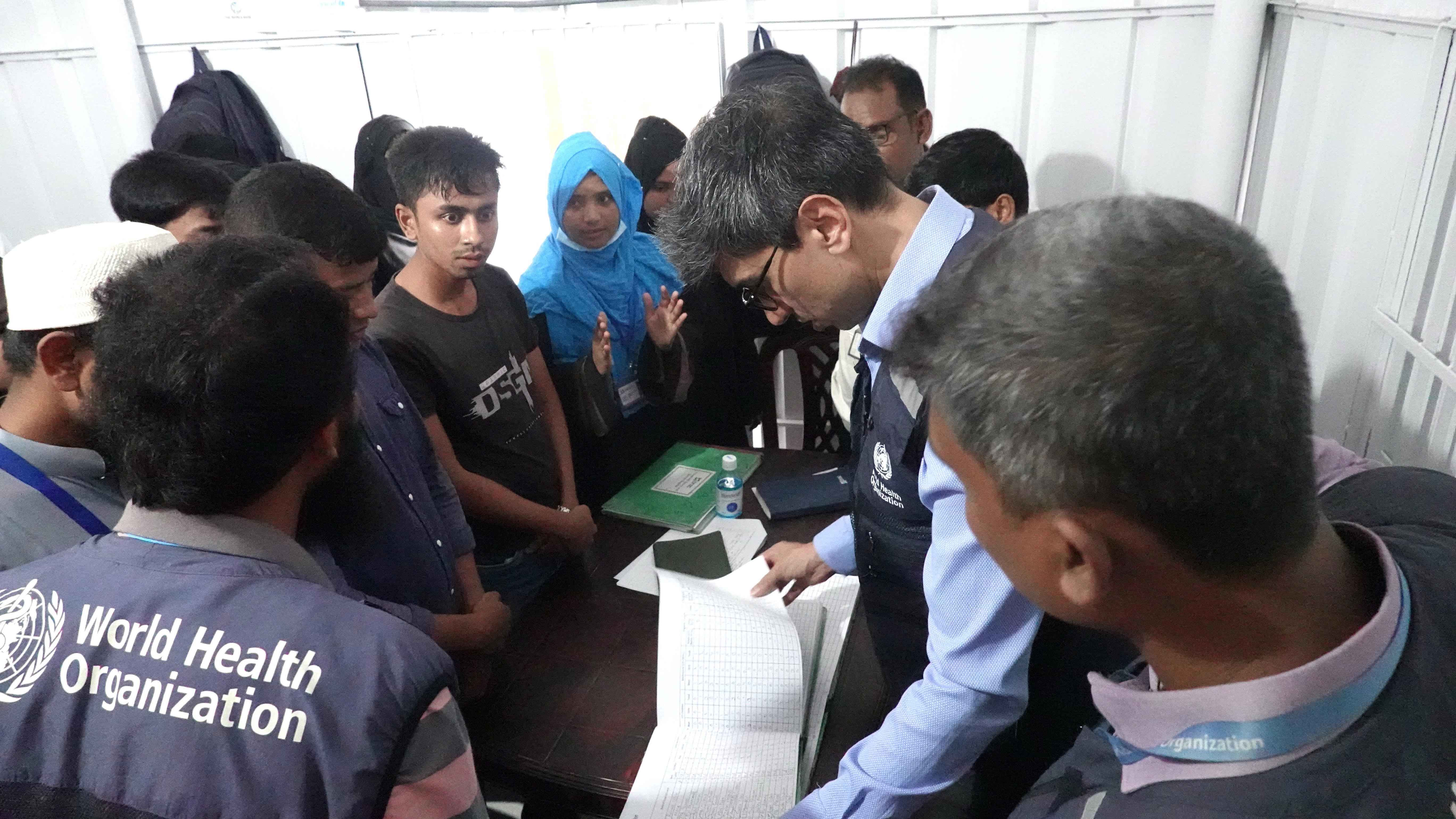 The Deputy WHO Representative engages with Community Health workers at the BRAC Health Facility to discuss frontline healthcare services and community outreach programs.