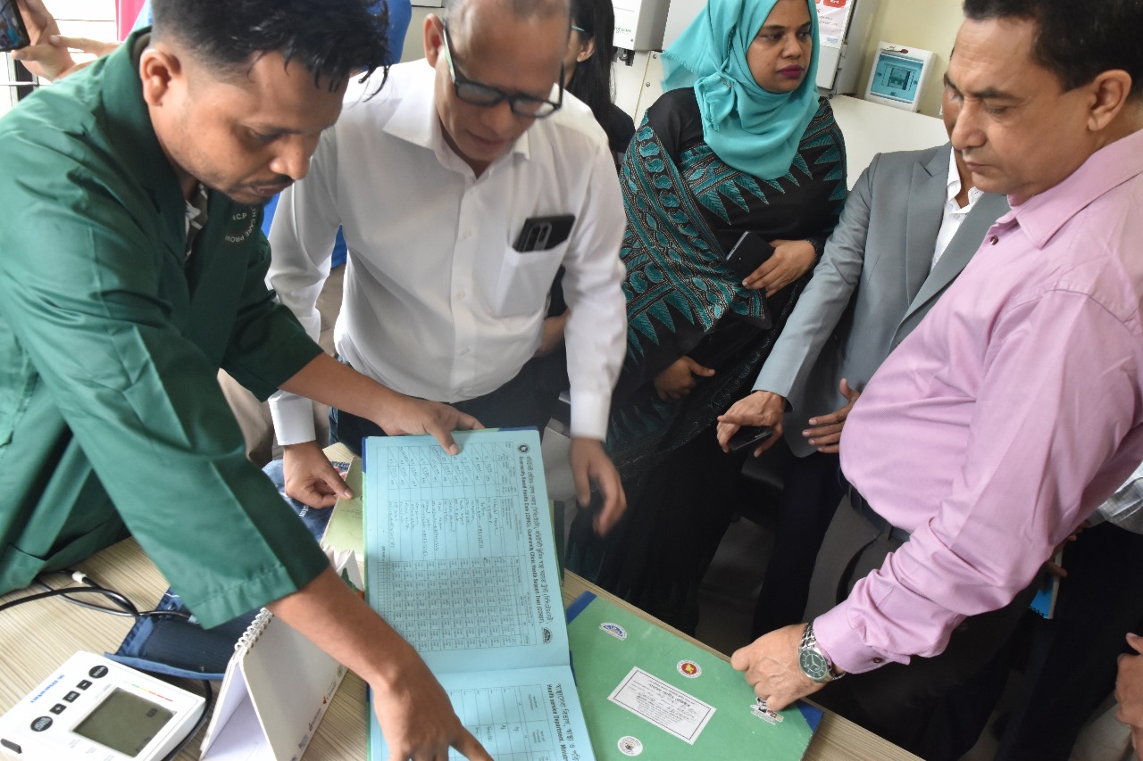 Honourable Health Secretary discussing Non-Communicable Disease (NCD) services with a healthcare worker at a clinic in Teknaf Upazila, Cox’s Bazar, Bangladesh