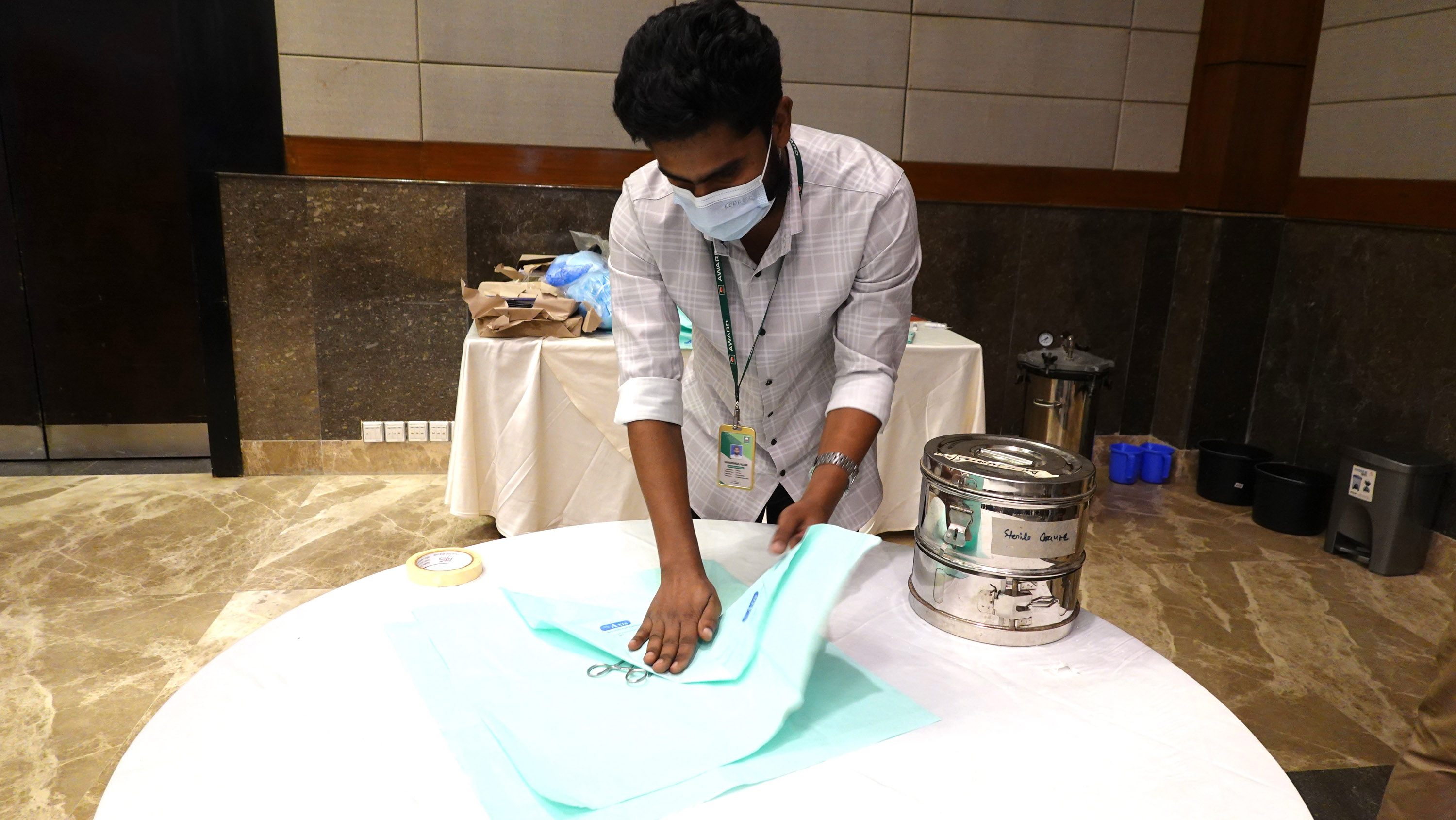 One of the participants is the appropriate packaging of sterile medical tools as part of the infection prevention training