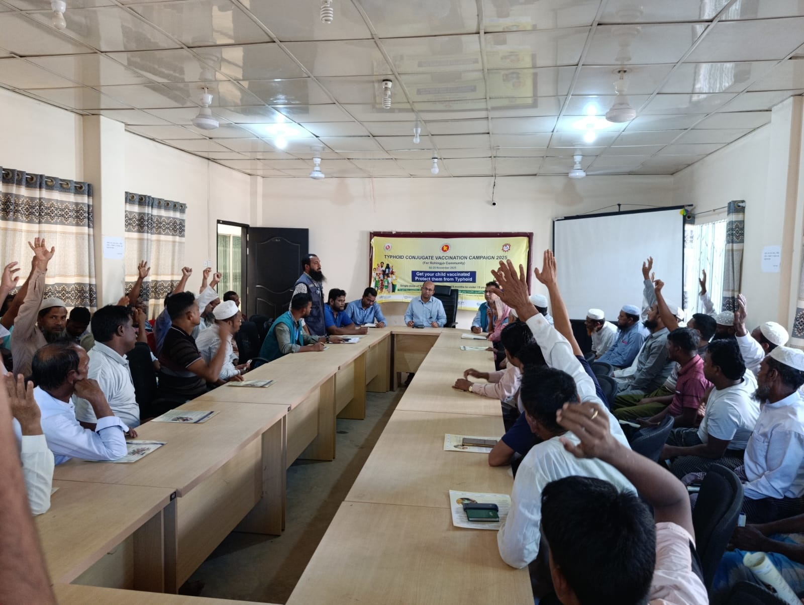 Majhis and imams participate in a community engagement meeting