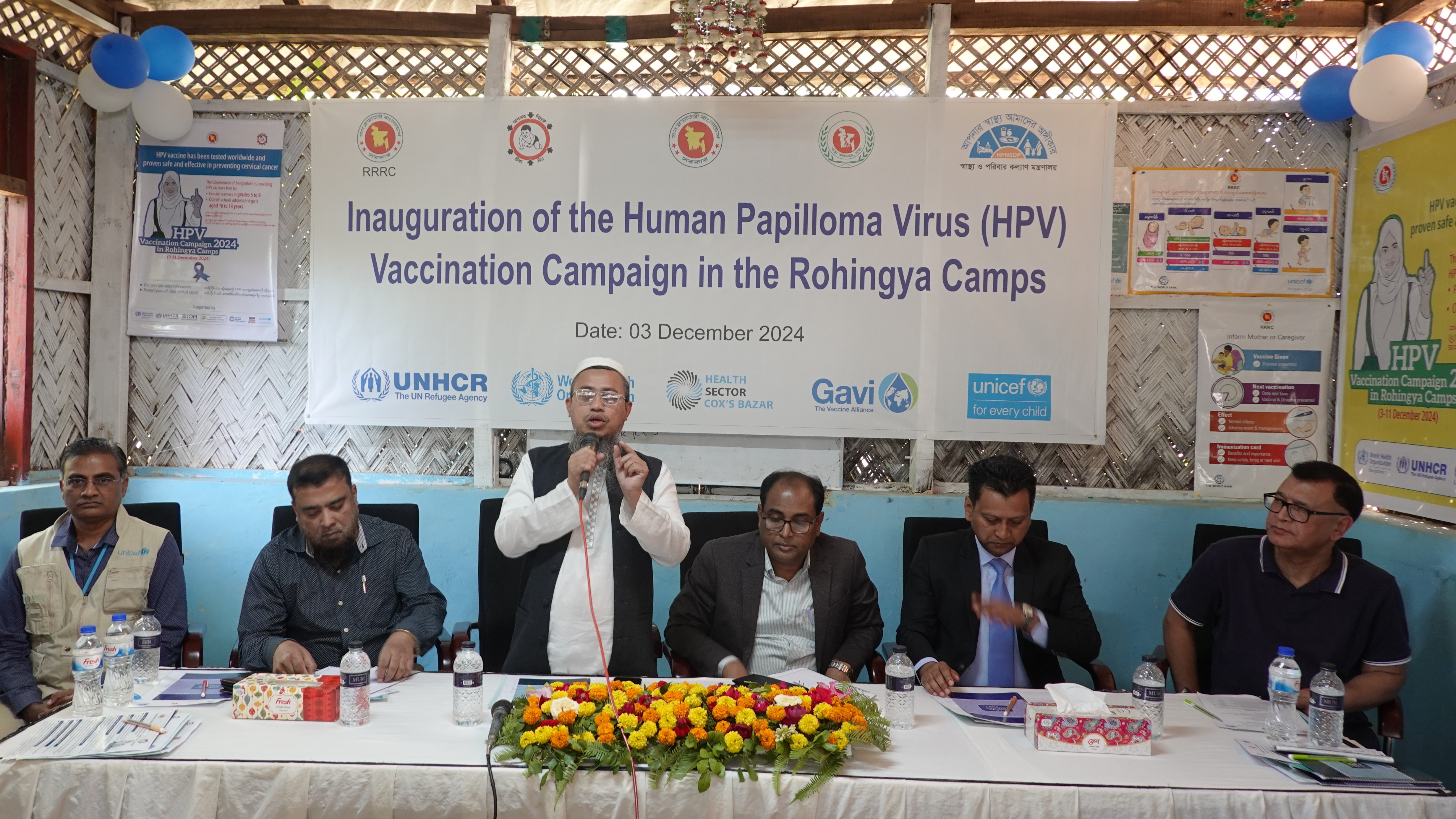 Members at the dais during the HPV vaccine inauguration event in Rohingya refugee camps, emphasizing community health protection.