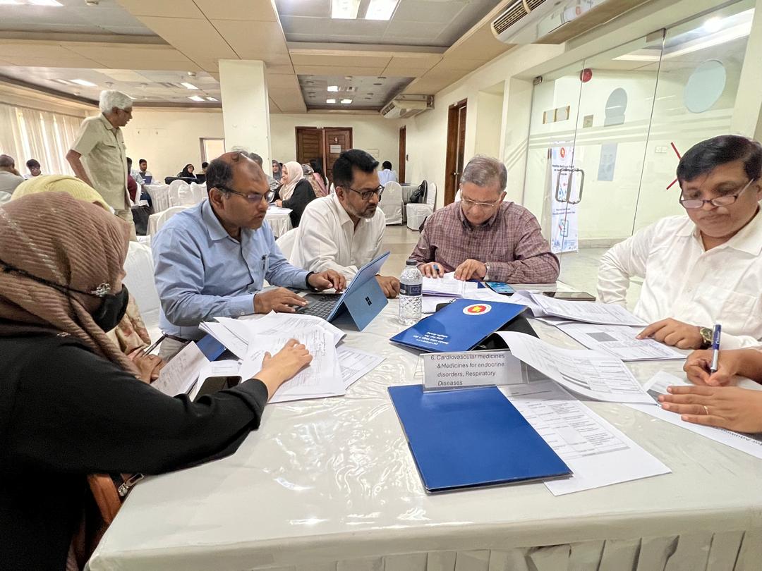 Academics and policymakers from Bangladesh engaging in group work to review the draft of the NEML.