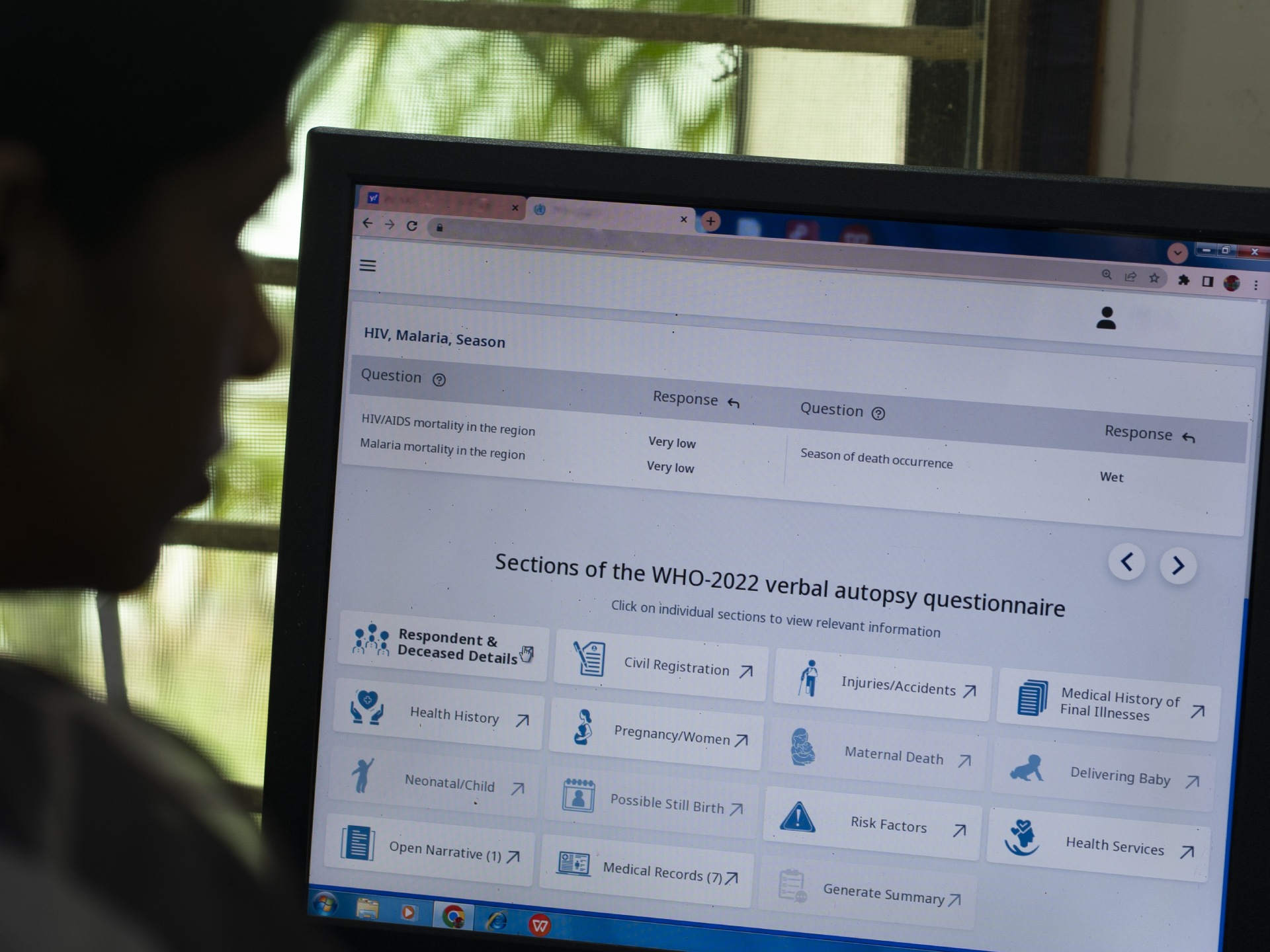 A medical officer reviews the verbal autopsy data and case histories