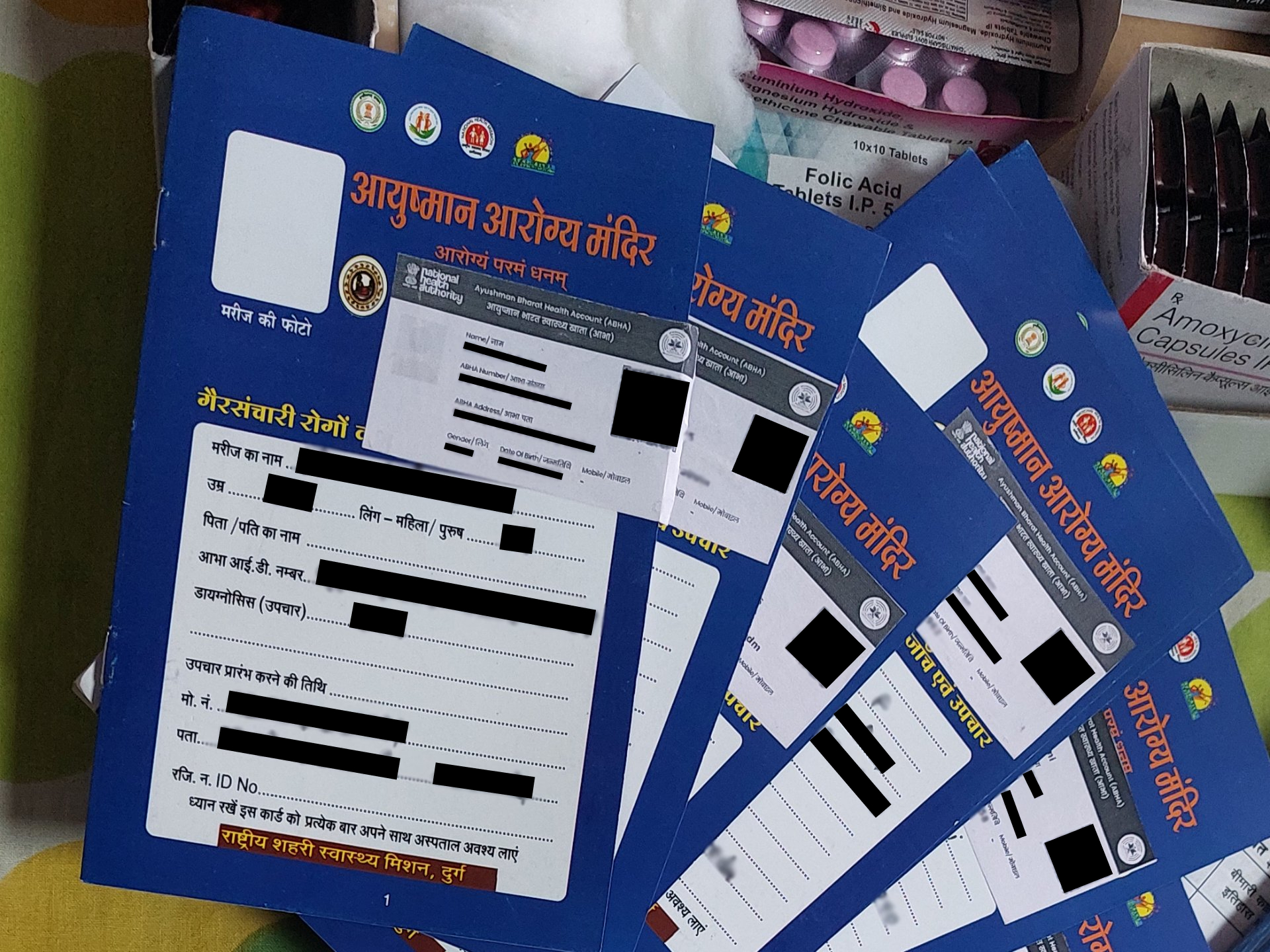 ABHA IDs are printed and pasted on the patient’s NCD card at Urban AAM Mahuwari in Durg, Chhattisgarh