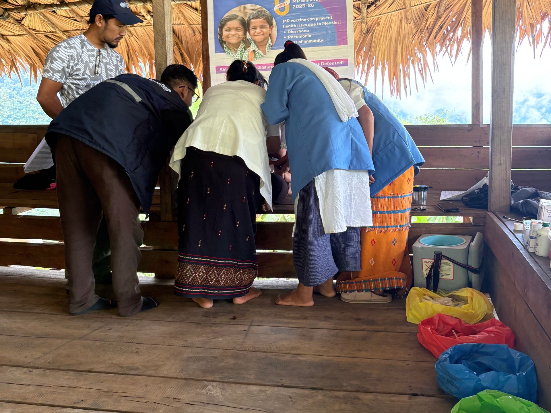 Makeshift colour-coded waste-collection bags being used at a temporary routine immunization site in Health and Wellness Centre
