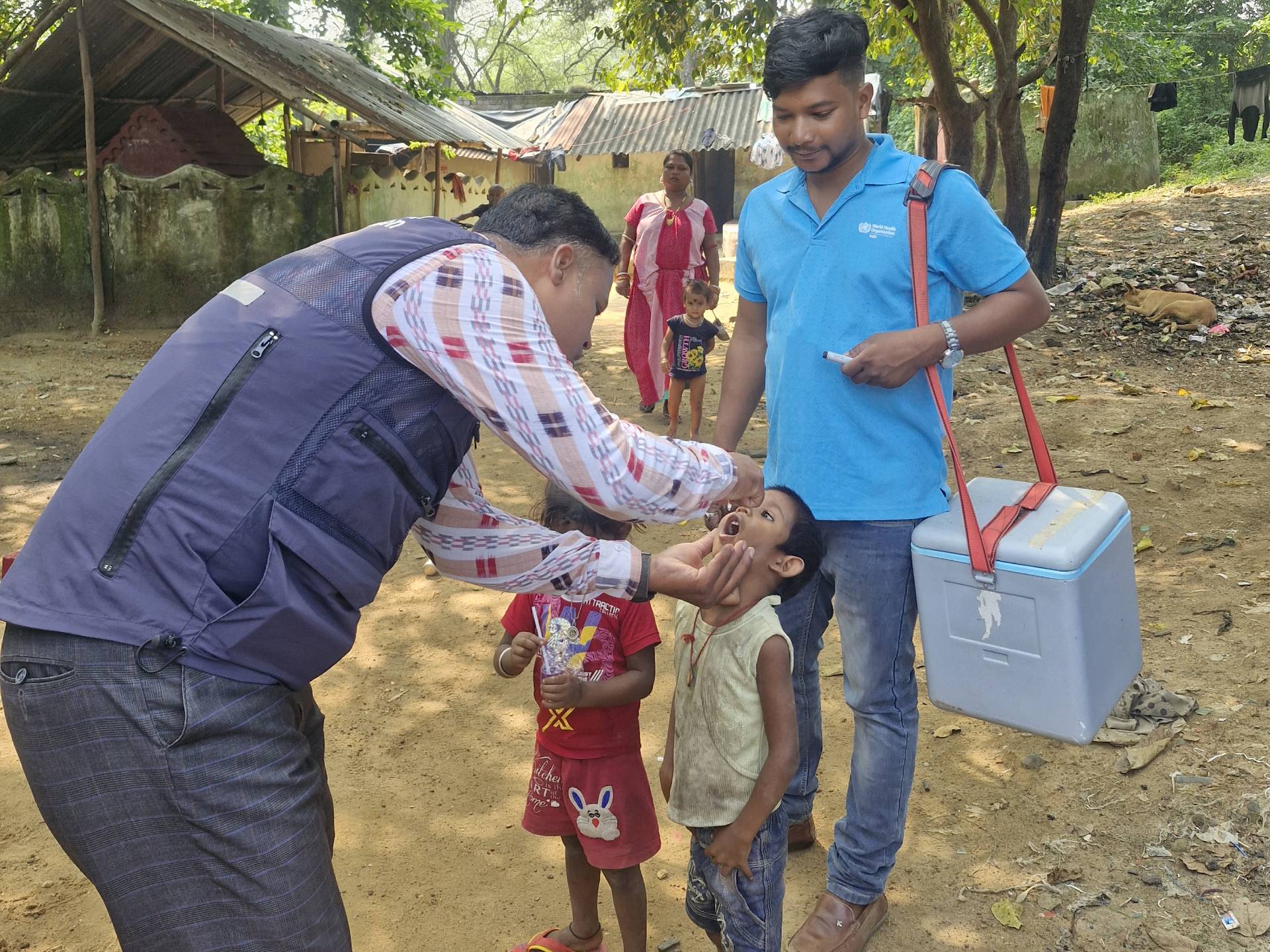 A WHO National Public Health Support Network (WHO-NPSN) team supporting the district teams vaccinate unimmunized children