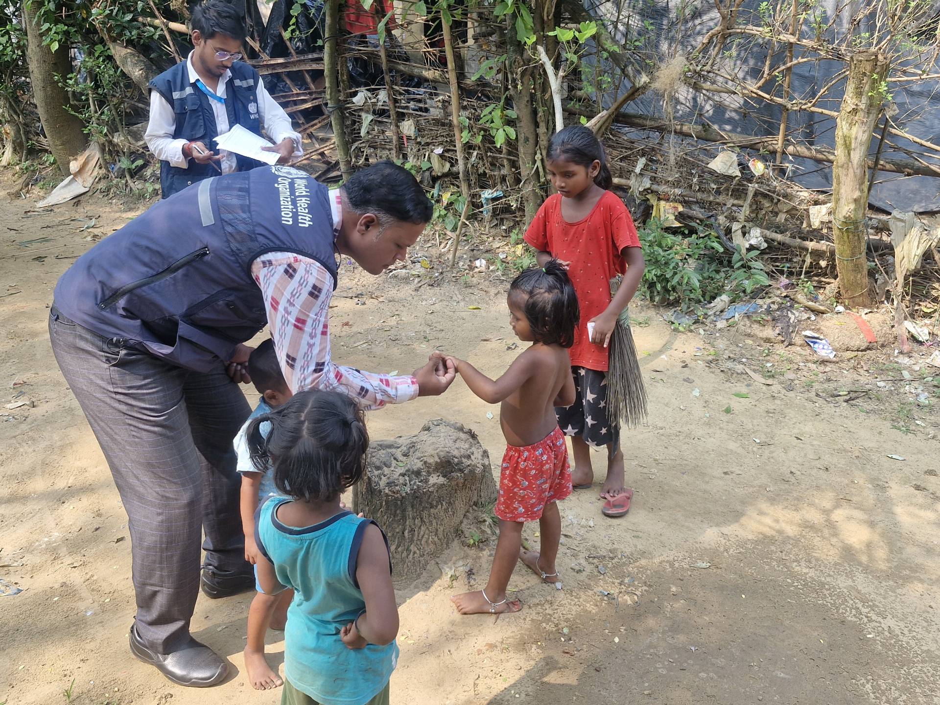 WHO National Public Health Support Network (WHO-NPSN) personnel checking the finger markings
