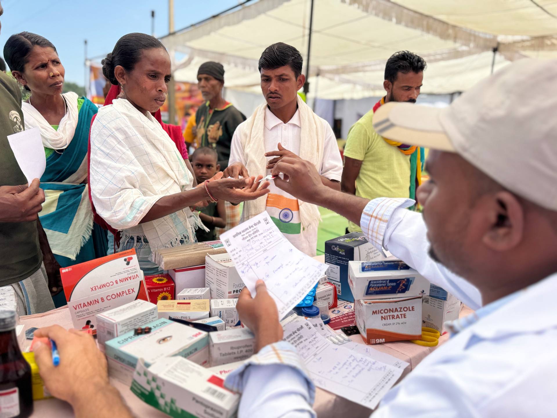 Women queuing up to receive free medicines following screening at SHC Potali