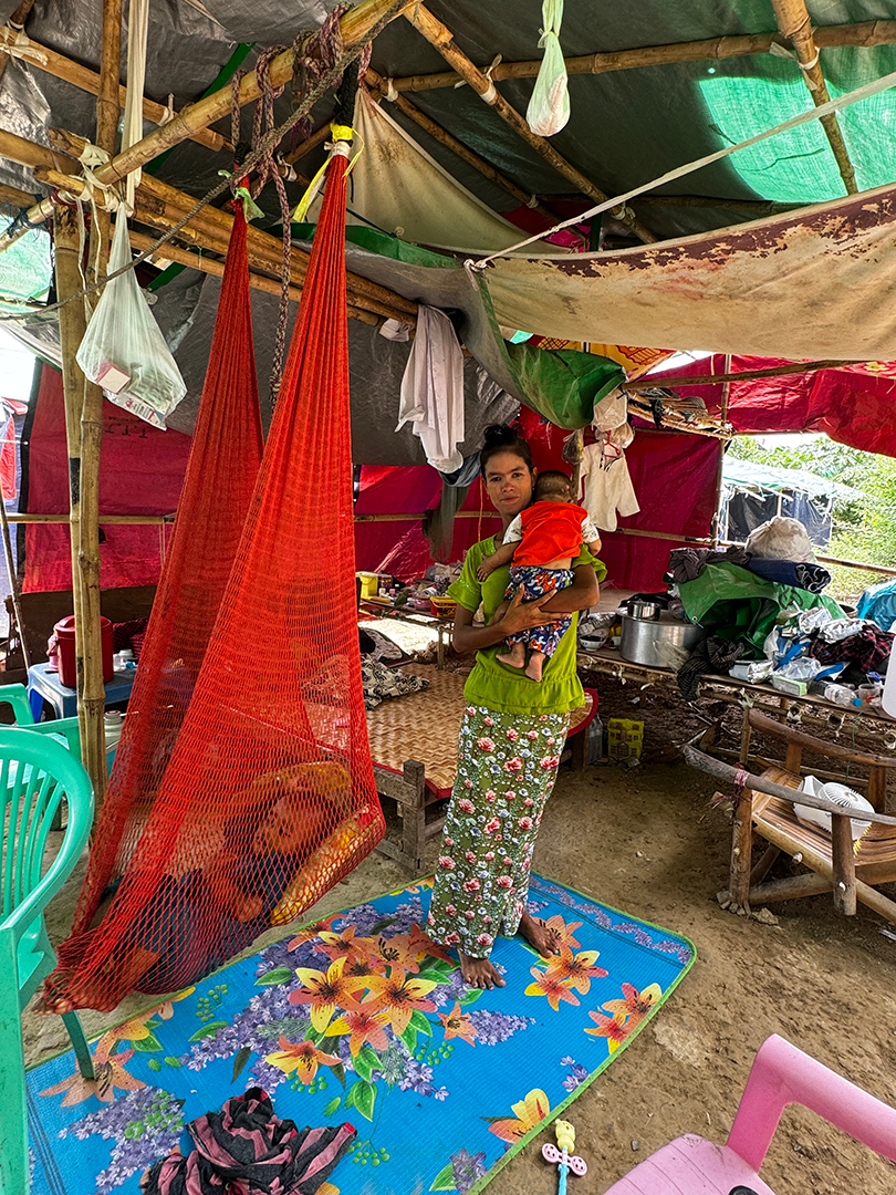 a mother of two and her baby, in their makeshift shelter from Mandalay earthquake relief camp