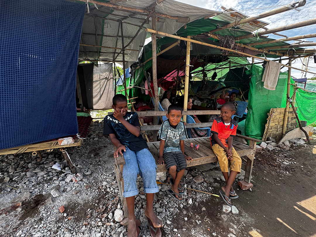 Children from the Mandalay Tar Li Swa earthquake relief camp infront of their makeshift shelter