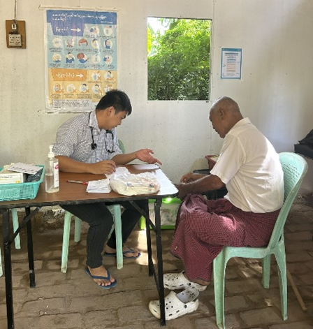 Receiving free essential health services at WHO health partner mobile clinic 1