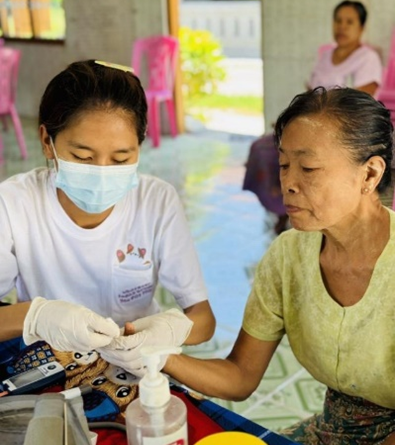 Receiving free essential health services at WHO health partner mobile clinic 4