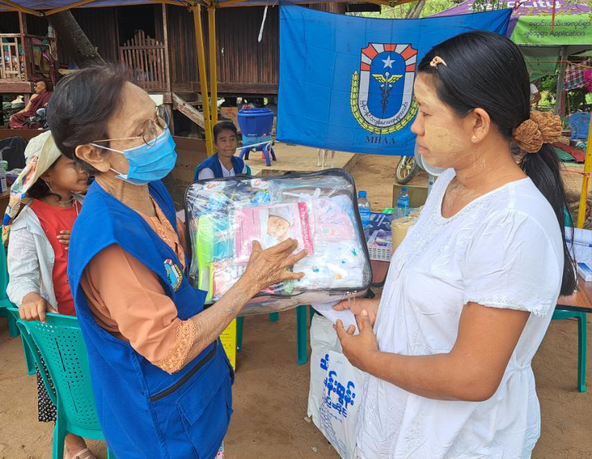 WHO health partner distributing Mother and Baby Packs to earthquake affected communities
