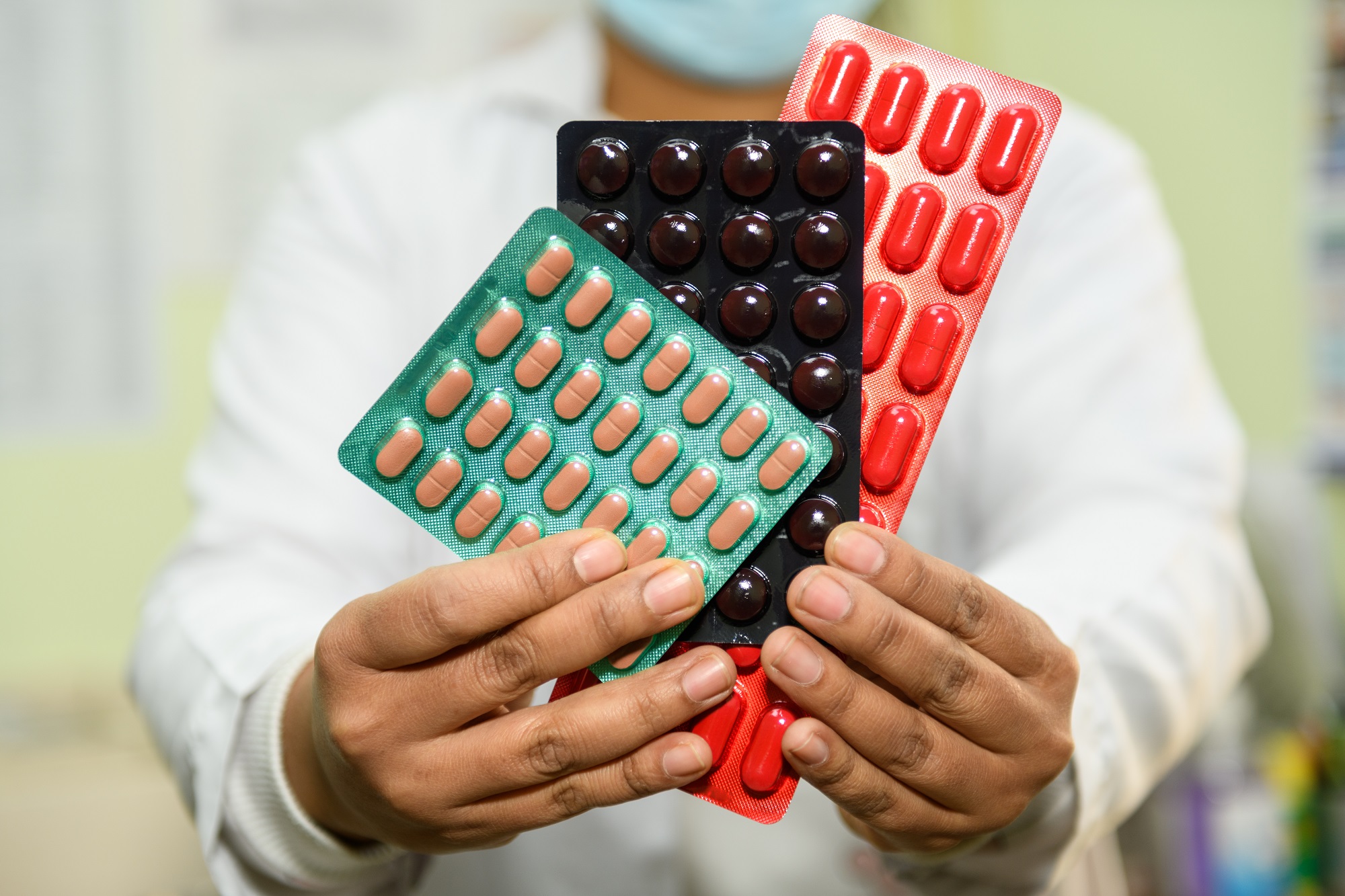 A health-care worker showcasing medications used for the treatment of multi-drug-resistant tuberculosis in Bagmati Province, Nepal
