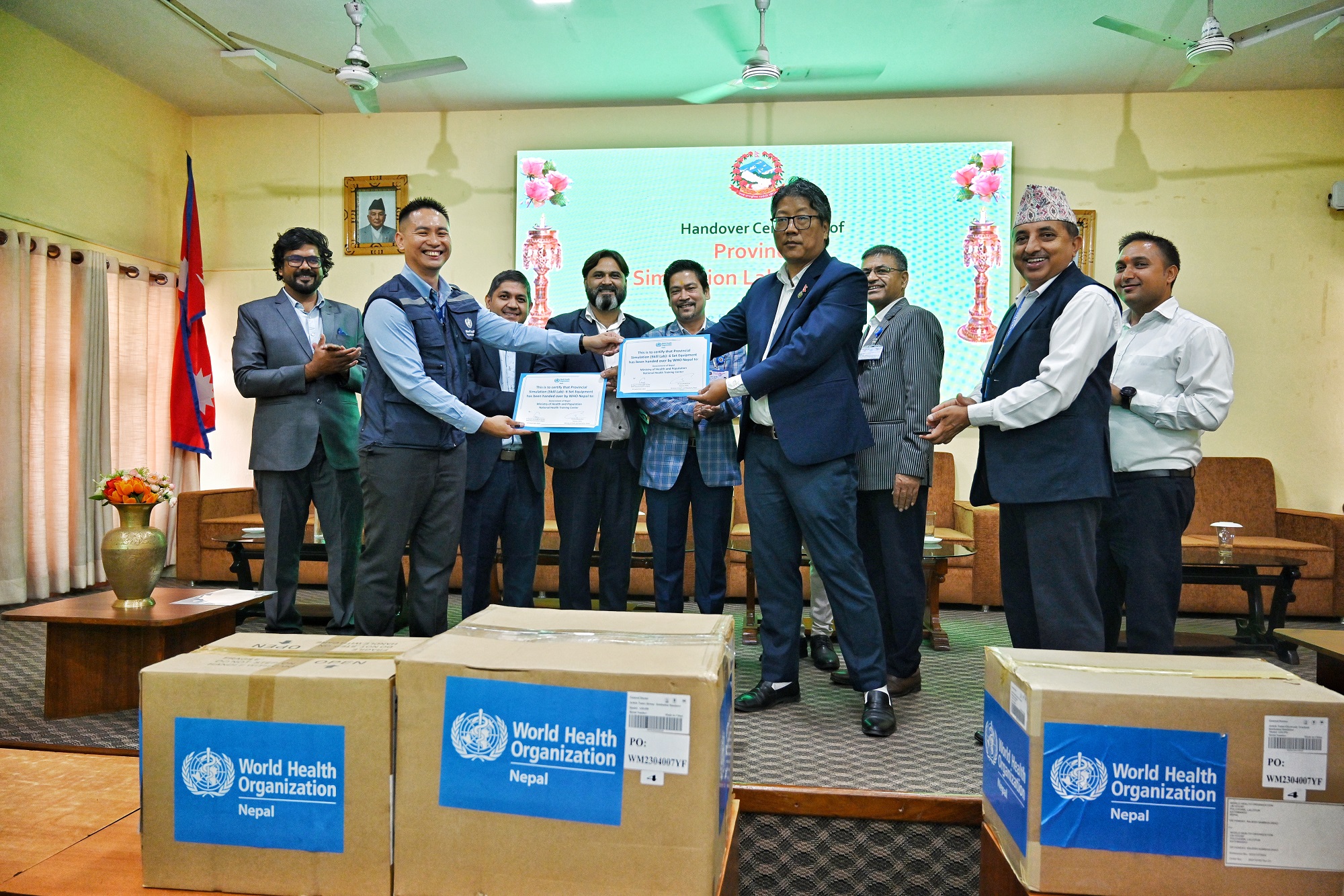 WHO (left) hands over simulation lab equipment to the Ministry of Health and Population for provincial distribution in Bagmati province, Nepal