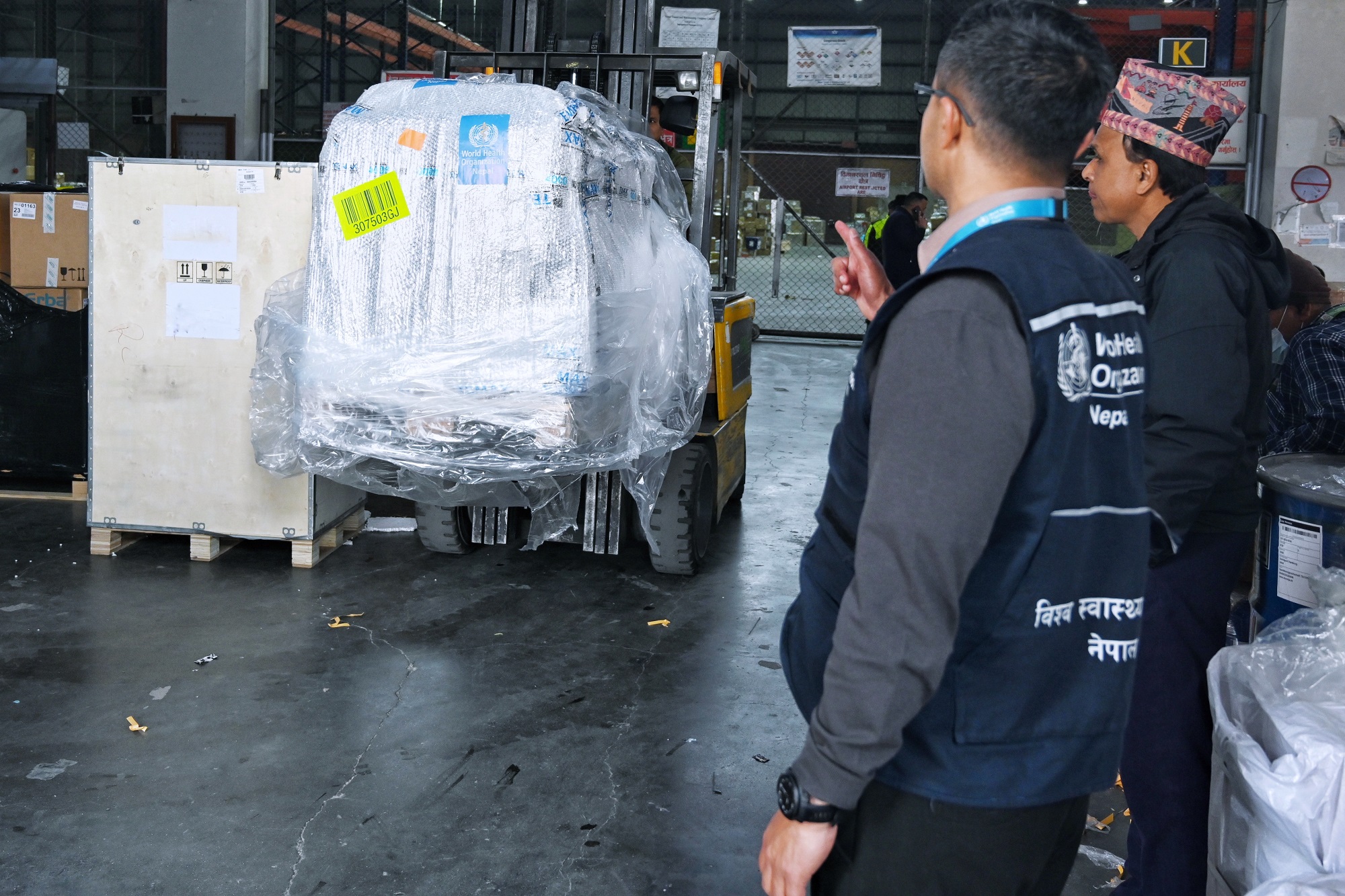 The first batch of essential cancer medicines under the Global Platform for Access to Childhood Cancer Medicines (GPACCM) in Nepal being transporated by a forklight machine in am aiport warehouse