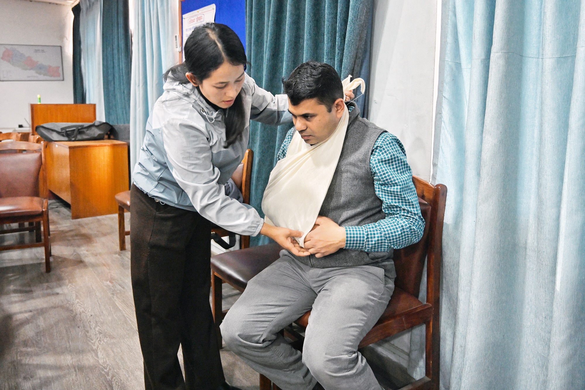 A trainee practices bandaging a fracture during a  training of trainers session for Community First Health Responders held in Bagmati province, Nepal