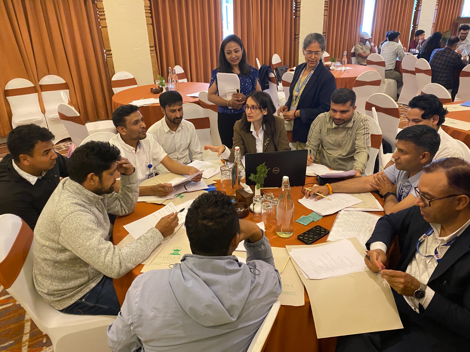 Participants actively involved in the consultative workshop on updating guideline for design and construction of Nepal's health building held in Gandaki province, Nepal