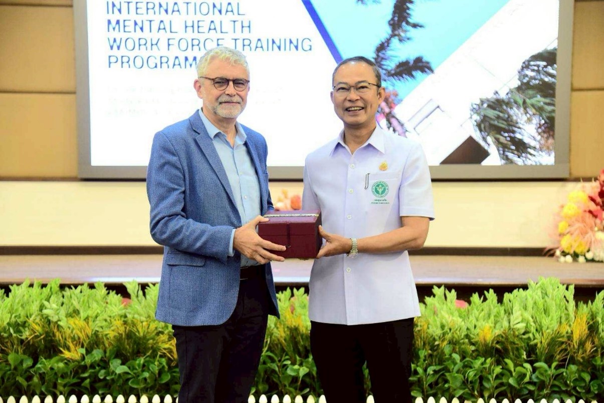 Dr. Kittisak Aksornwong, Director General of Department of Mental Health, Ministry of Public Health awarded a token of appreciation to Dr Jos Vandelaer, WHO Representative to Thailand