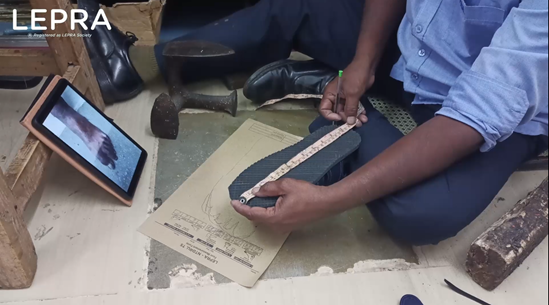 Foot measurement being taken for special footwear