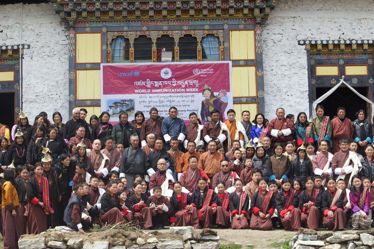 Community members, students, and local leaders gathered during World Immunization Week in Bhutan to promote vaccination and public health awareness.