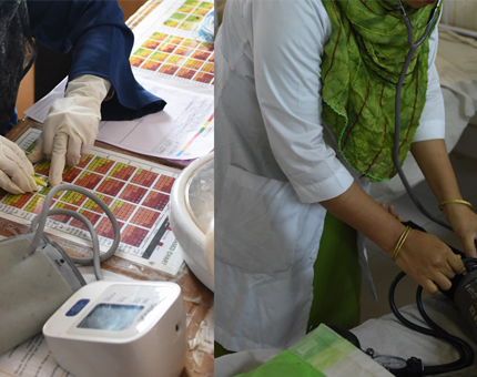 two female healthcare workers with blood pressure monitor