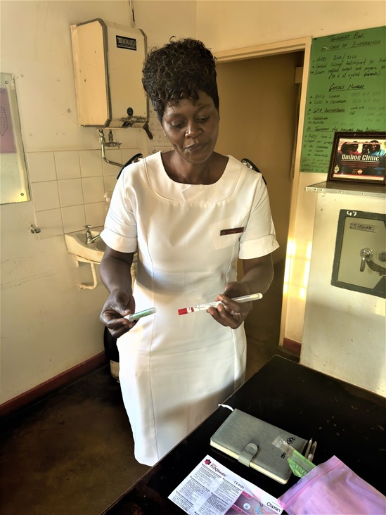A nurse holding a self-sampling HPV kit.