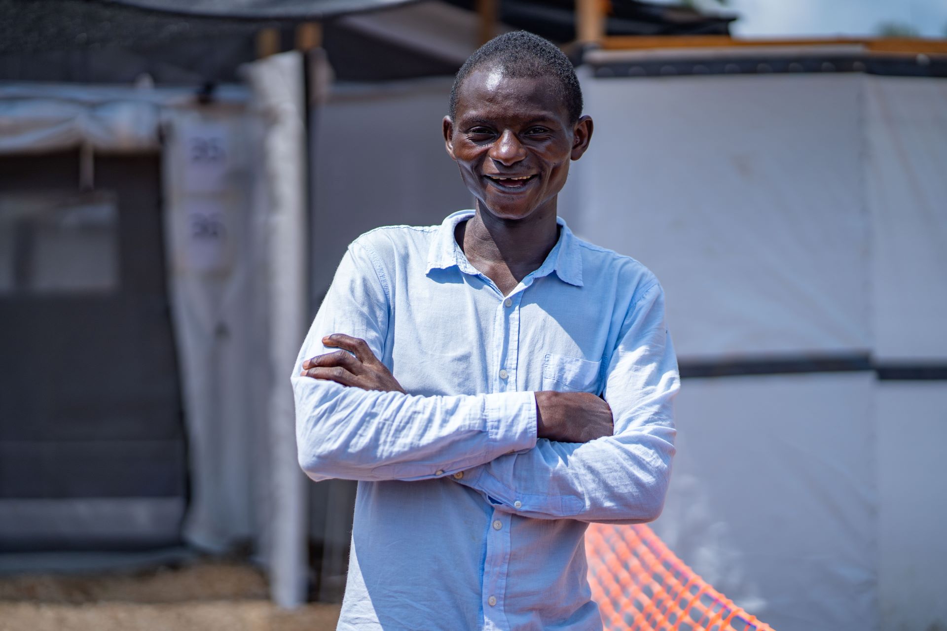 Man crossing him arms and smiling