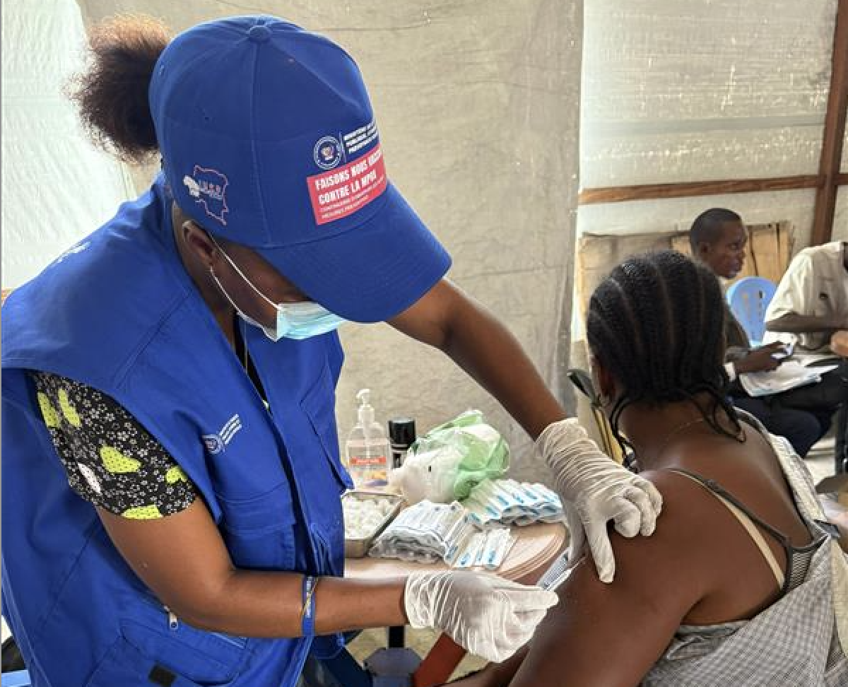 Health worker giving vaccine