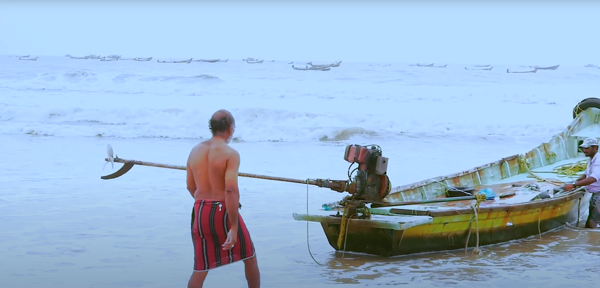 Apparao fisherman cataract A fisherman walking towards his fishing boat