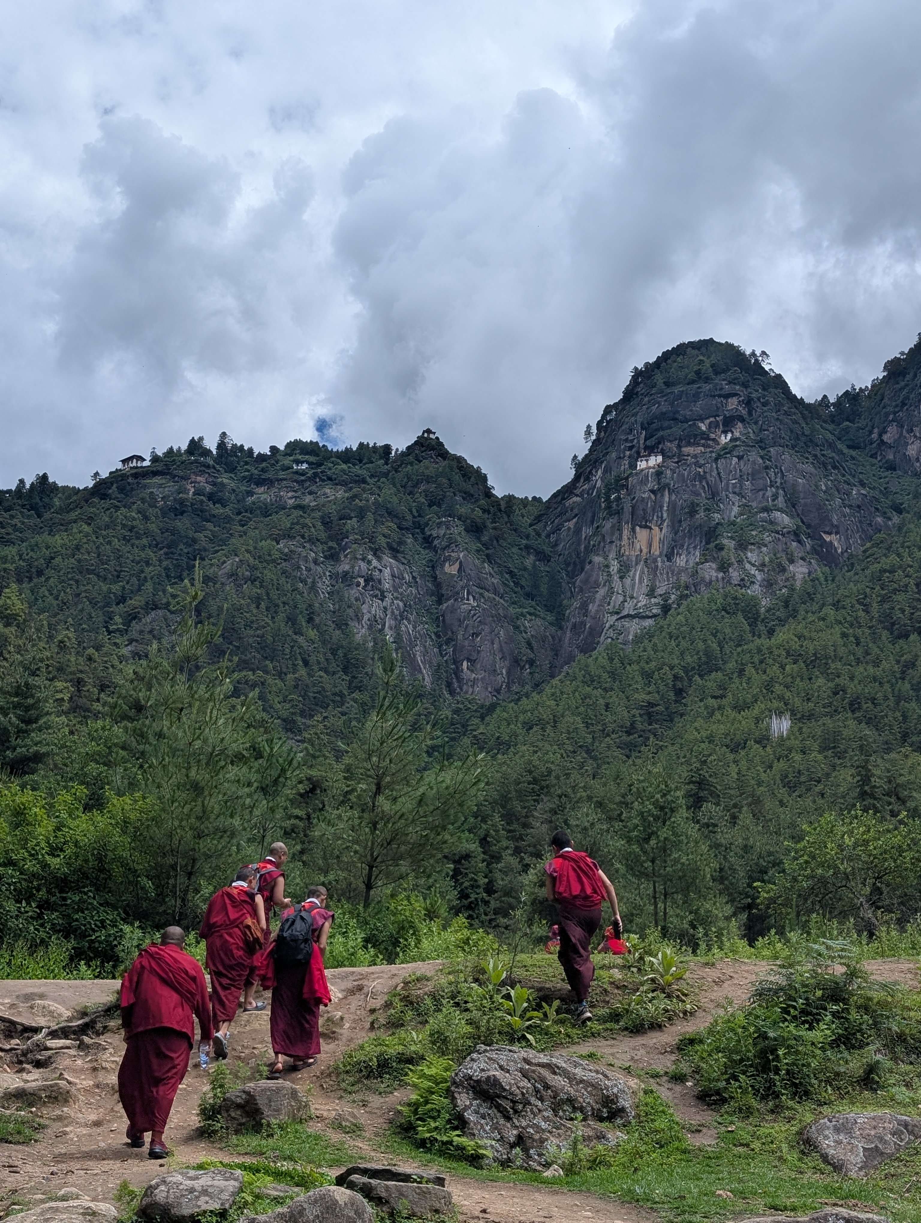 A group of bhudists monks walking outdoors
