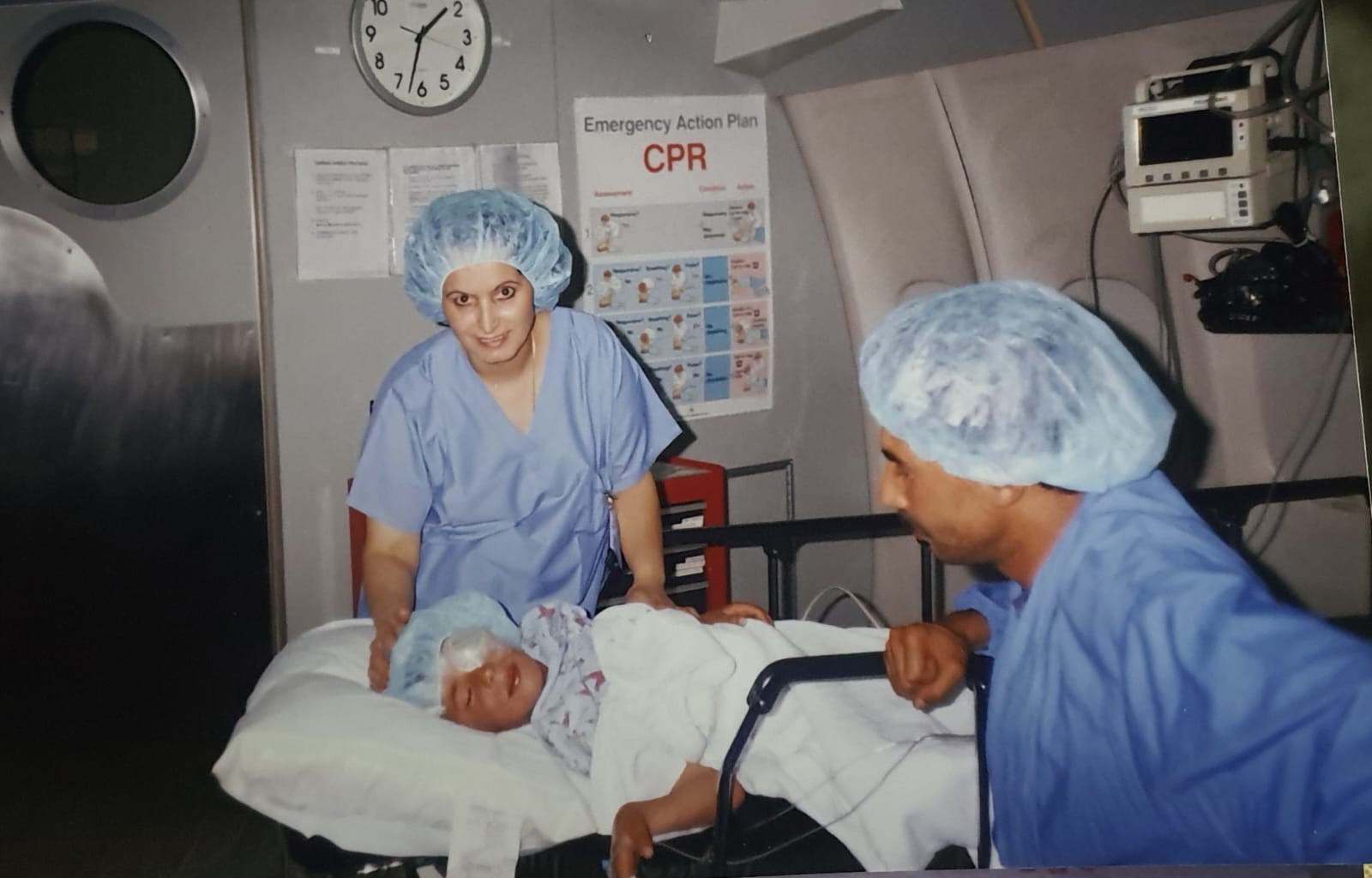 Ophtamic nurse after a surgery with a patient and a second health worker