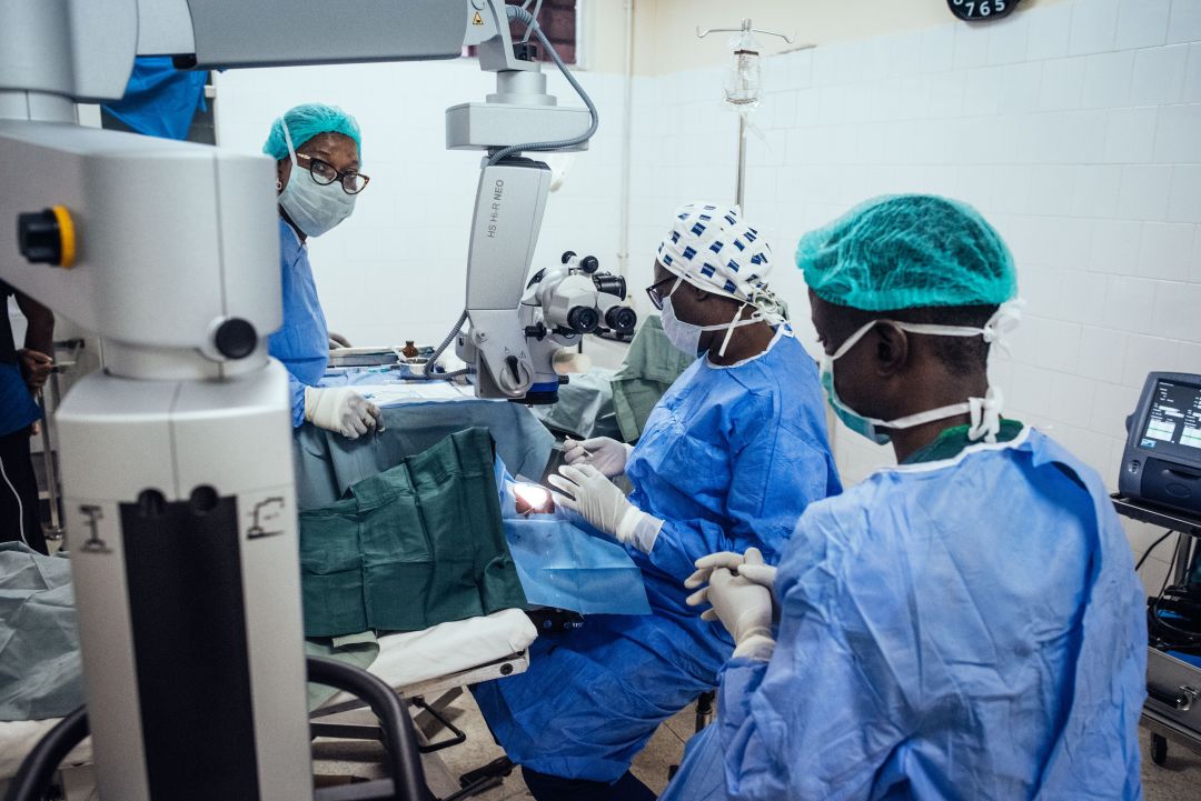 Operation room with eye care professionals untertaking cataract surgery